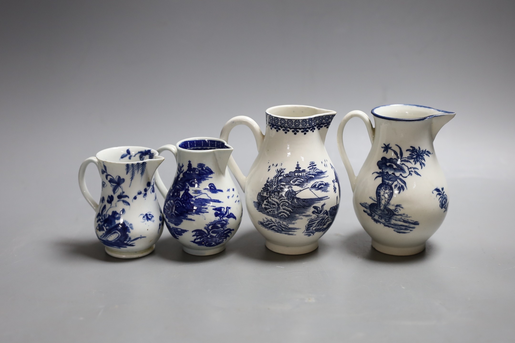 Four late 18th century Worcester blue and white sparrow beak jugs, tallest 12cm